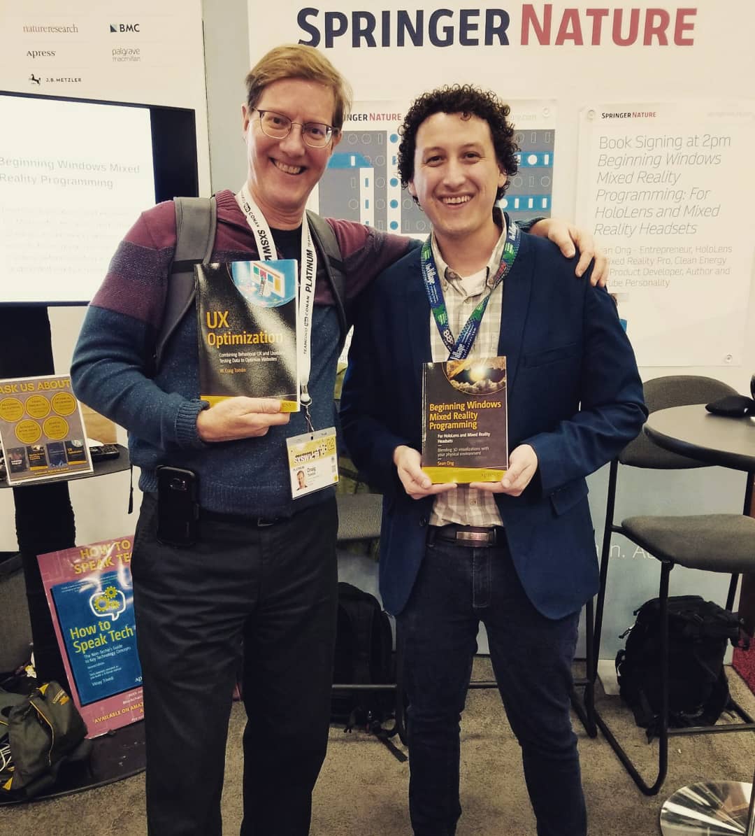 Apress's tweet photo. Highlights from Day 3 of Apress exhibiting at #SXSW2019! We tested out the HoloLens, had author @sean_ong sign copies of his book for fans, and raffled off some of our most popular VR books! Come visit us tomorrow at booth 1321 (our last day in Austin!) for more. #SXSW #SXSW19 https://t.co/DIqzMMzytB