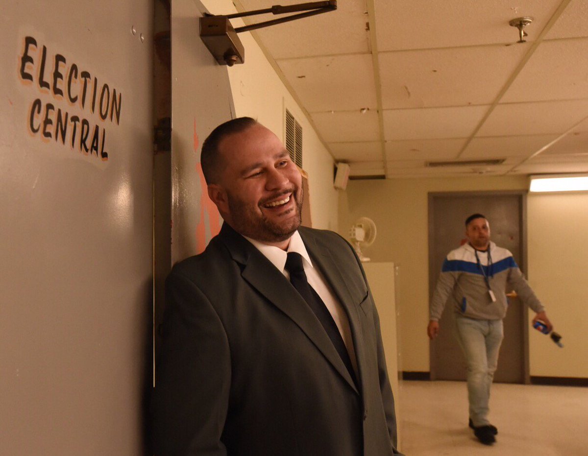 Former mayor Will Flanagan banters with journalists outside Election Central.