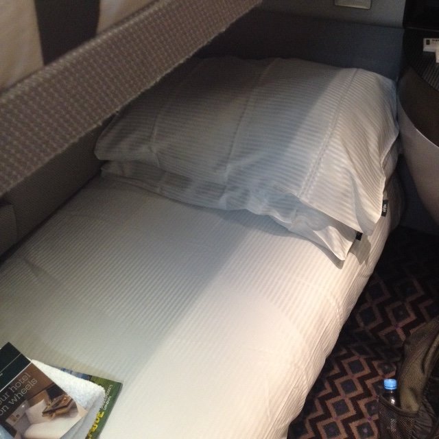 A bed on a sleeper train, in the UK