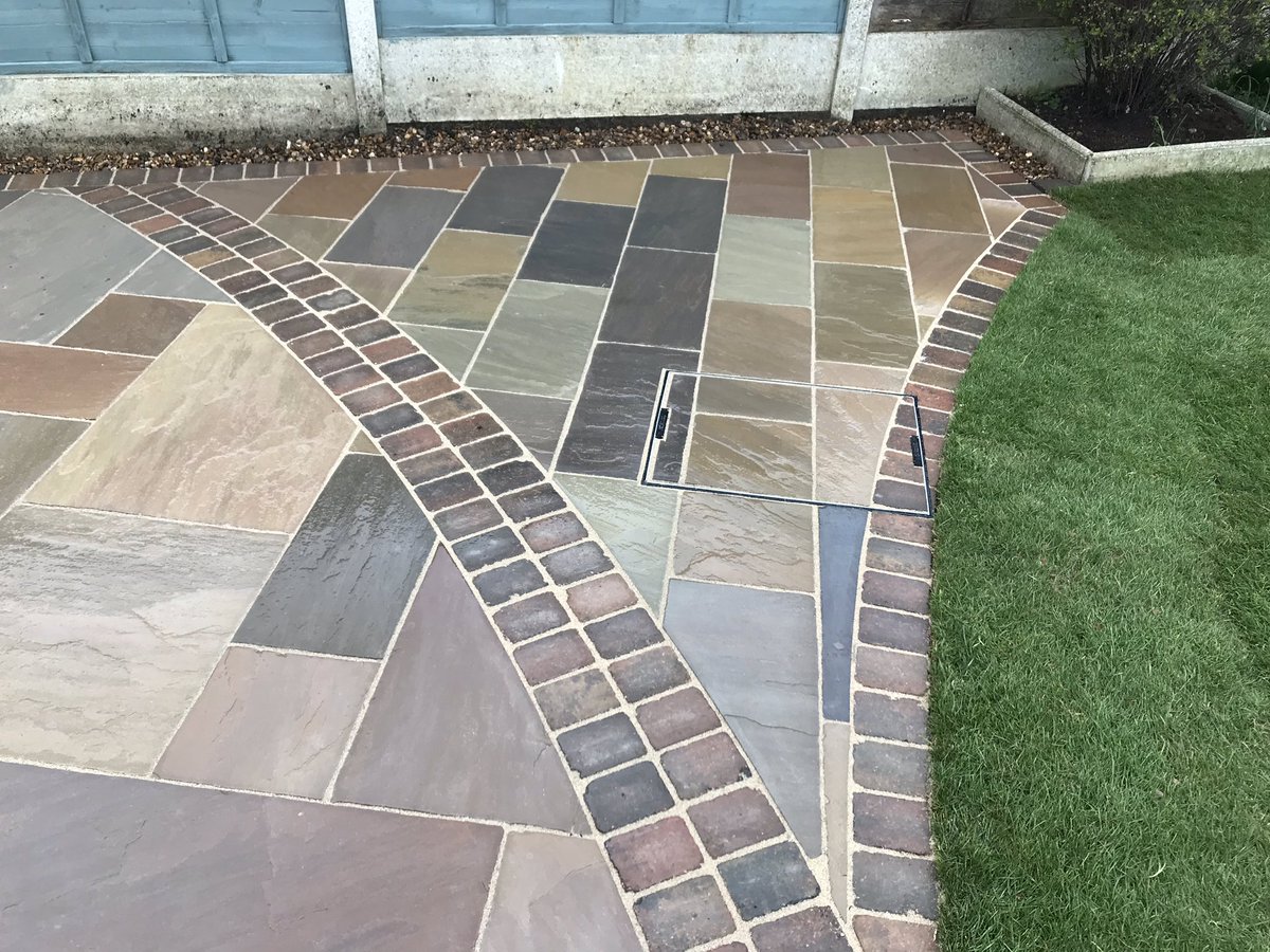 leeharveydesign's tweet photo. @BradstoneUK @Sarahhennem latest project finished today autumn green sandstone with autumn Woburn rumbled blocks used to create this radial design.2 love hearts cut out to create 2 memorial bed for roses to be planted 👍🏻 https://t.co/l9wjWkW9MD