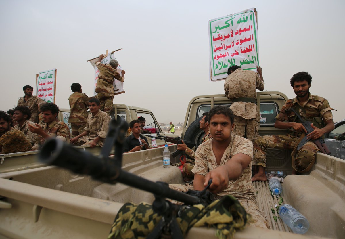 Houthi rebels with a banner reading "Allah is the greatest. Death to America, death to Israel, a curse on the Jews, victory to Islam." Credit: Reuters
