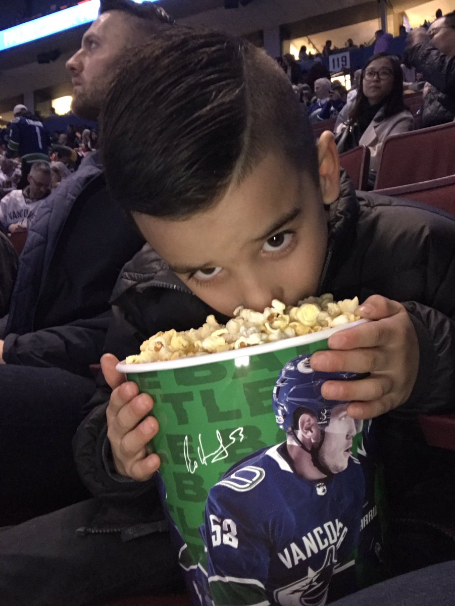 CortneyLessard's tweet photo. Someone loves his bottomless tub of popcorn.  Go Canucks Go!!! #WeAreAllCanucks https://t.co/zeEdagbYfU