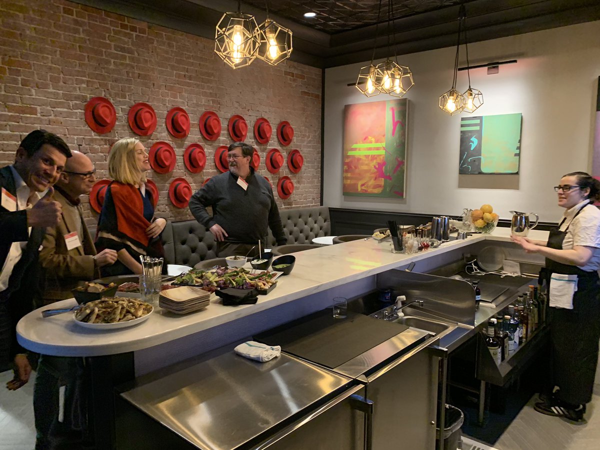 tcrawford's tweet photo. .@GinnyHam and the @RedHat #Enterprisers team kicking off #CIOChatLive in the Necco building. Look carefully and you may find the hidden speakeasy. 🤫 @jayferro getting in on the pic w/ @_jfeldman @efeatherston in the speakeasy. https://t.co/qOgHw5h2B1
