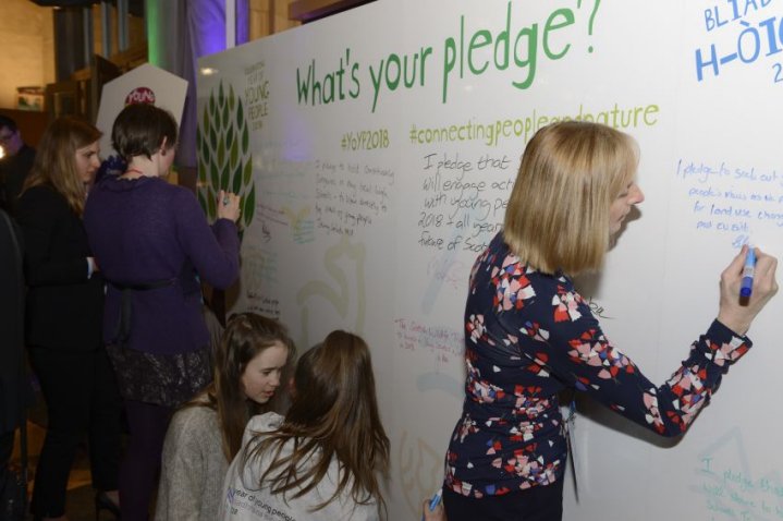 NatureScot's tweet photo. During our parliamentary reception for #YOYP18 MSPs used our pledge wall to make commitments to help young people. @JennyGilruth has held a pupil surgery in every high school she represents, giving her "one of the most valuable experiences of 2018"😃 #connectingpeopleandnature https://t.co/ZST9tdIDlj