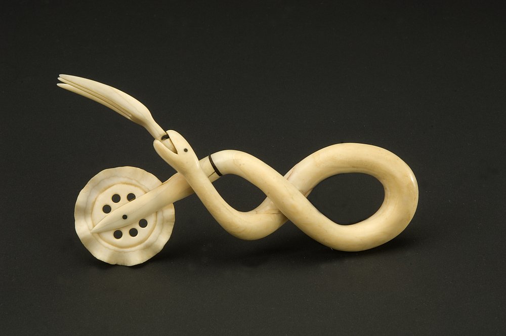 amhistorymuseum's tweet photo. The fluted wheel of pie crimpers like these were used to cut dough or seal the top of a pie crust to the sides before baking. This one is an example of scrimshaw, a carving by a sailor made of whale teeth or bone. What type of pie would you bake with this sea serpent? #PiDay https://t.co/P7jicrNlkl