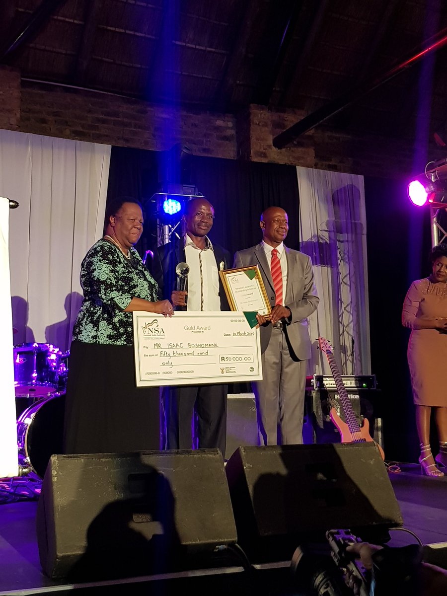 SAgovnews's tweet photo. Pandor and Qonde presents the Minister's Award to Isaac Boshomane from Soshanguve. The Most Outstanding award recognises an individual who has distinguished him/herself in their professional, organisation &amp; community within the #skillsdevelopment system #NSASkillsConference https://t.co/atzE010TEJ