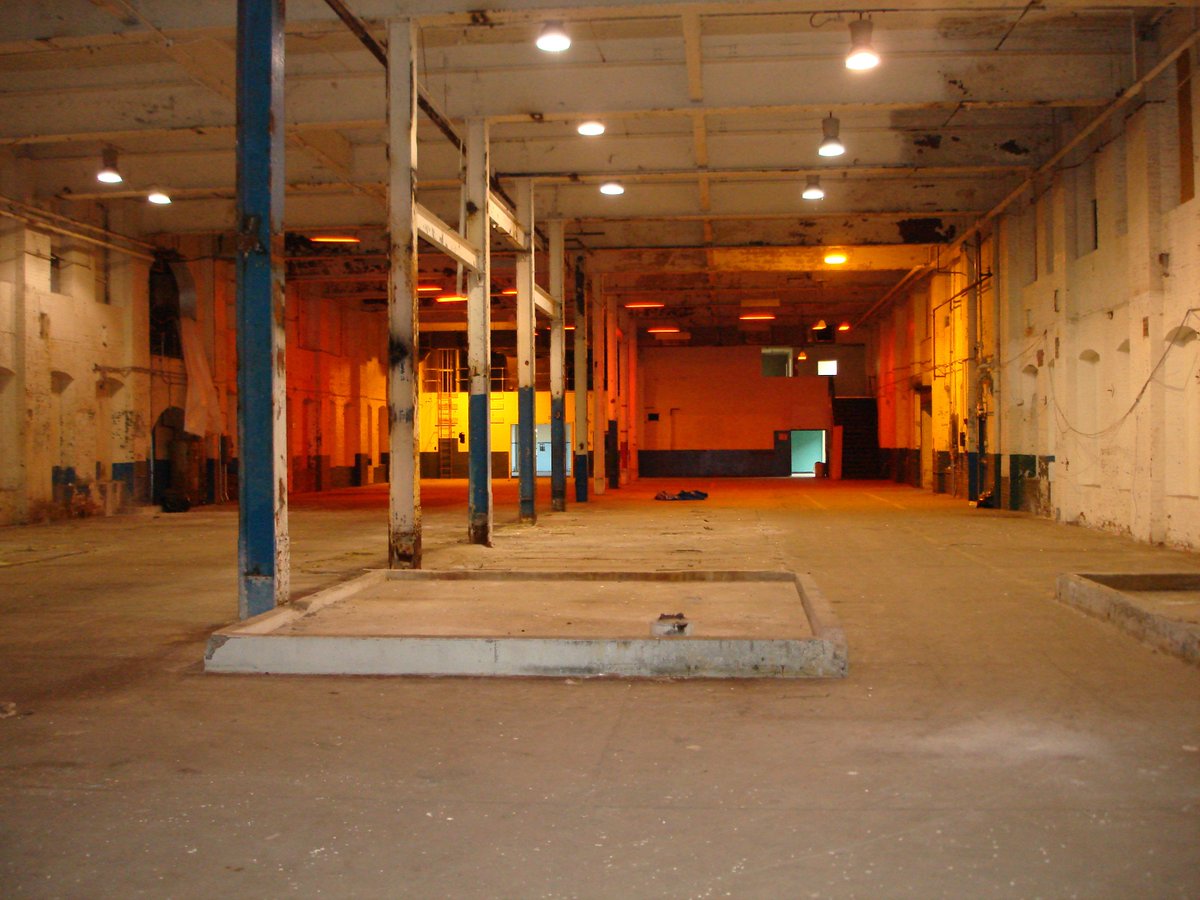 This is Mill 3, 1st floor. It's a double height space and a little more than 17k square feet of cool, clean warehouse space. Mill 3 was the third building built in the Open Square complex.