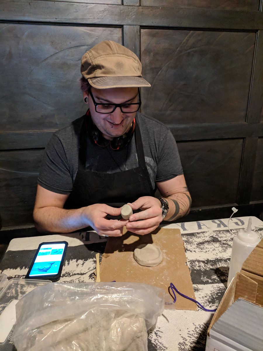 Found Thaniel in the back making a dolphin sculpture out of clay. #precious