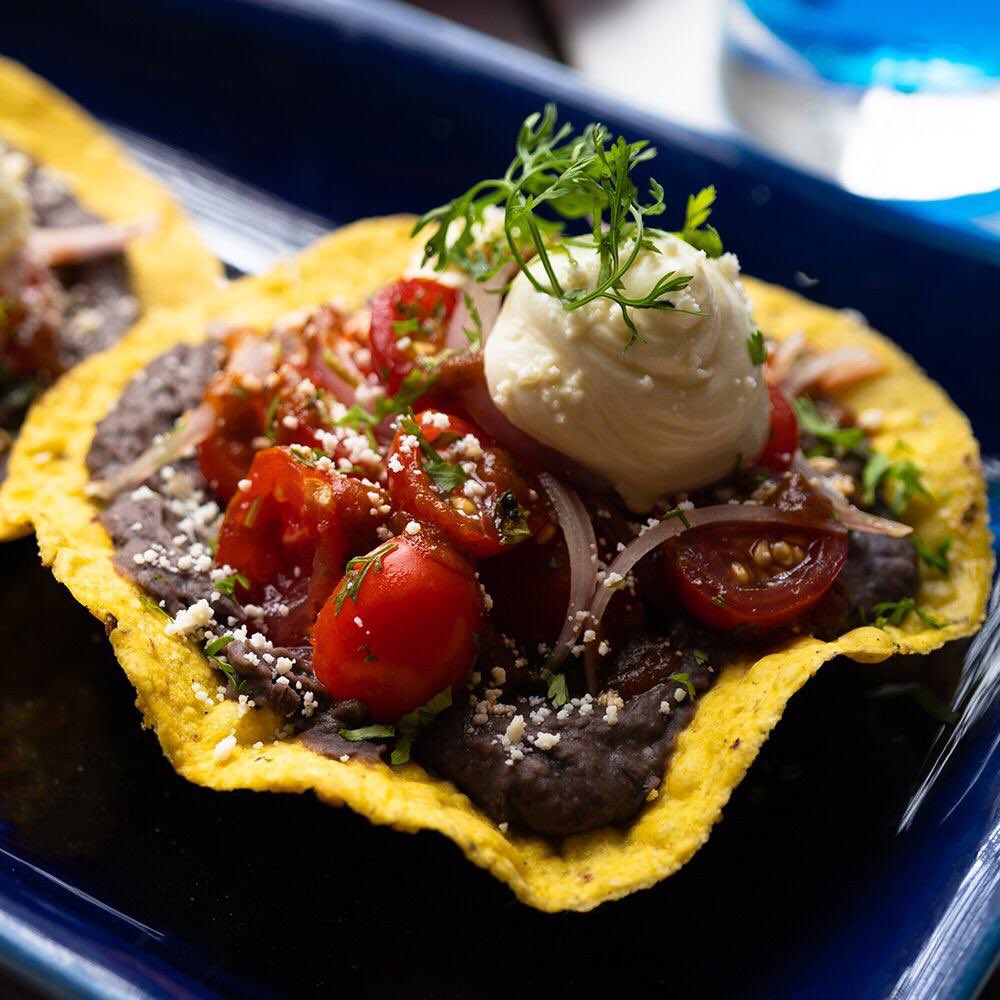 XicoIndia's tweet photo. Tostadas were invented about 2000 years ago around the Monte Alban ruins in Mexico. They are made of corn flour tortillas that can be served, baked fried or toasted. Travel back in time and try our authentic mouth-watering, black bean tostada today!! https://t.co/RO3gnX1FRy