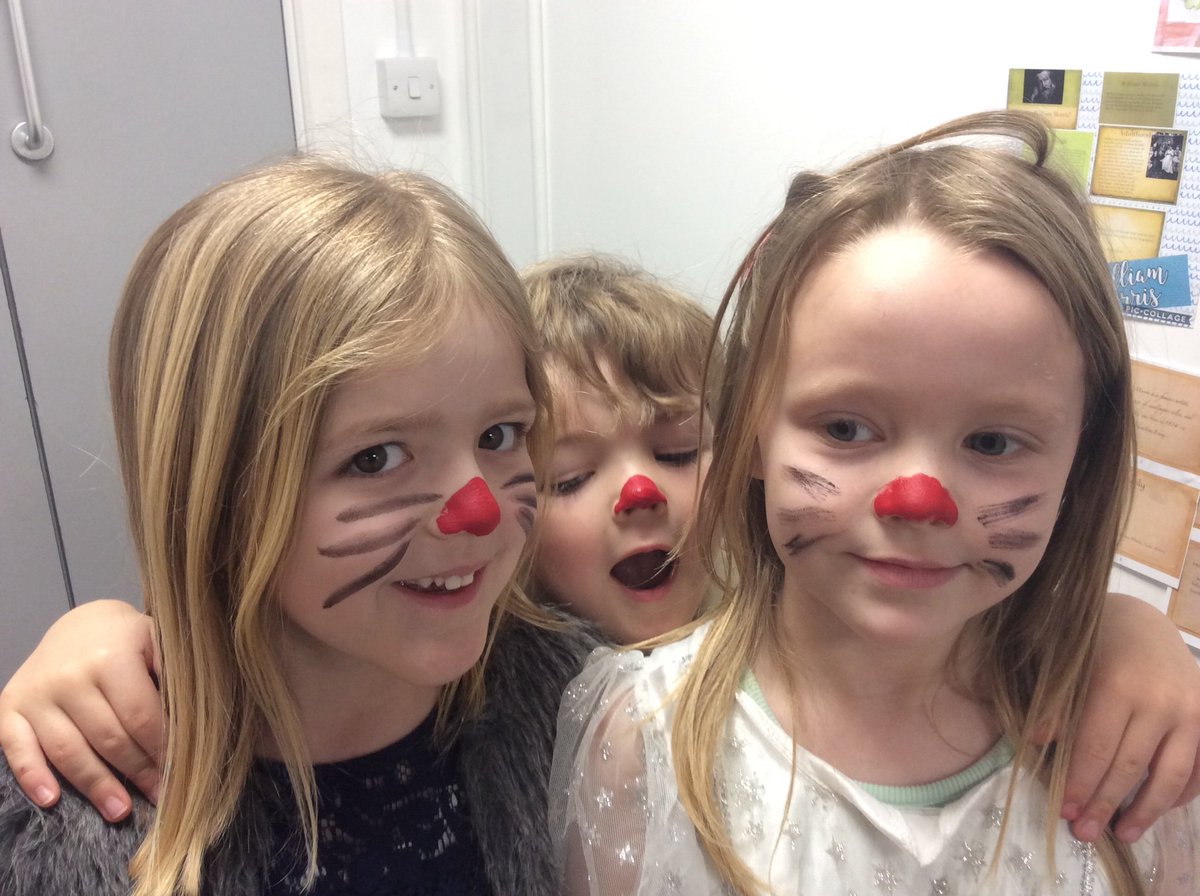 Having our noses painted for Red Nose Day.
