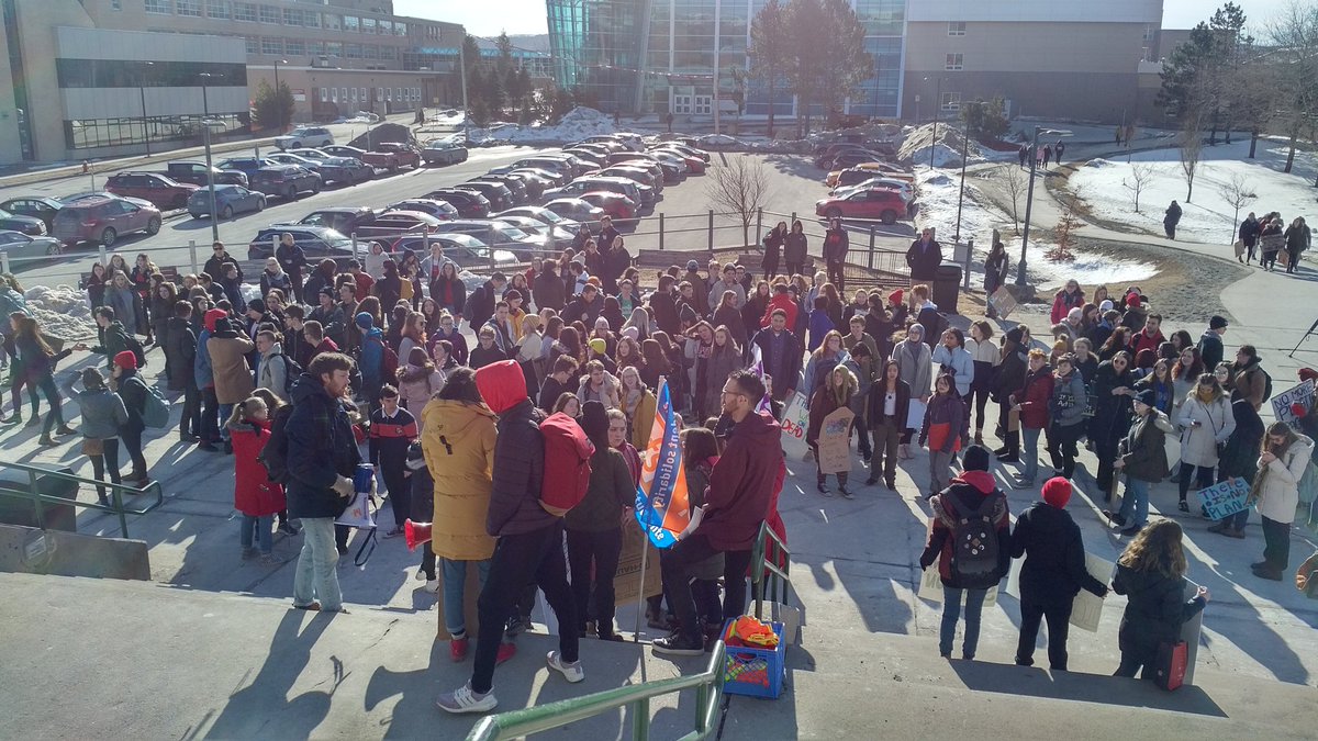 MikeConnors's tweet image. High school students gather at MUN clock tower to protest climate change.