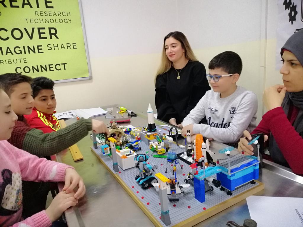 FawziehHn's tweet photo. Astrobots and NASA Knights teams during their last training before the competition #nerd #fll #flljr @DawhaHighSchool https://t.co/IMDHiveppS