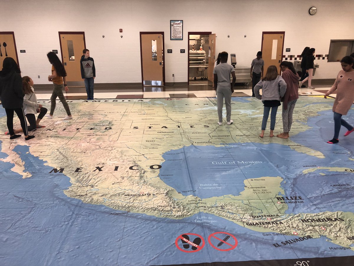 lauralissak's tweet photo. Bigger is better. Practicing locating cities with latitude and longitude using a giant North American map borrowed from @usgif. @MoorefieldES https://t.co/eEZT6pC84Y