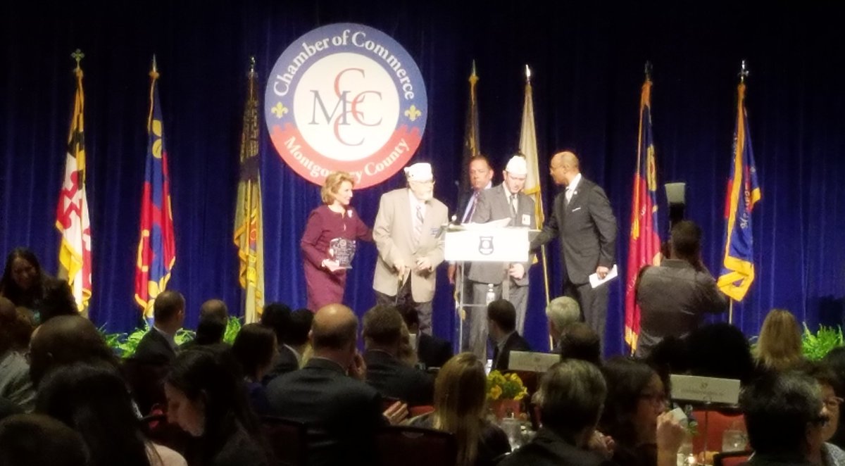 MCCCMD's tweet photo. Happening now: The first award is being presented to @AmericanLegion Department of Maryland. They received the Public Safety Partner of the Year Award, presented by Dr. Van Coots of @holycrosshealth. #MCCCPSA https://t.co/sA8Oj6ANeV