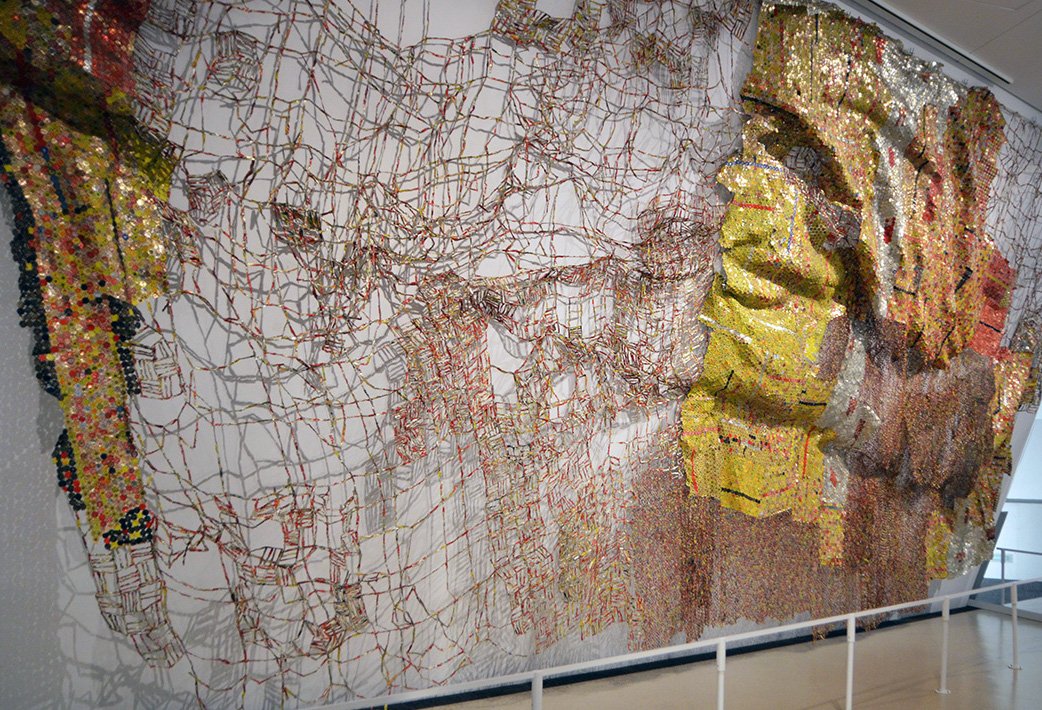 AllartDominique's tweet photo. Straying Continent (2010). Magnificent work of art! Metal #Tapestry made of discarded bottle tops by Ghanaian sculptor El #anatsui at the @ROMtoronto https://t.co/mBcseVxkGz