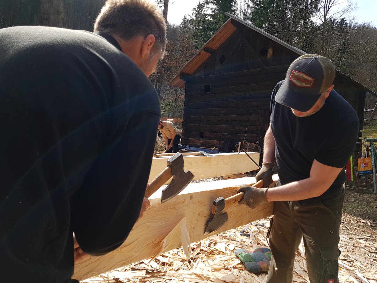The never-ending task of hewing logs.