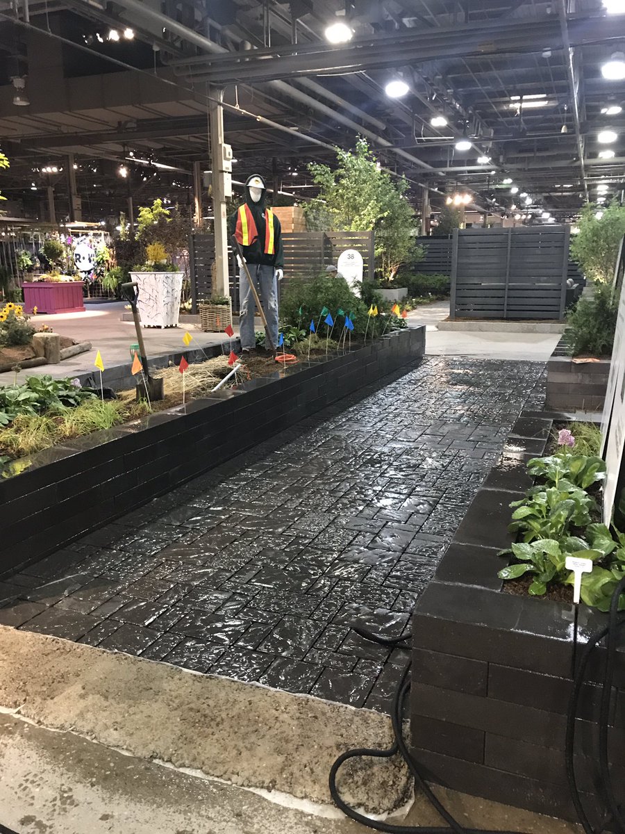 seanjamesdesign's tweet photo. Giving our #DigSafe Garden @canadablooms (for @ORCGA) 1 last going over. Watering with my amazing nozzle from #MarksChoice (avail. #HomeHardware from @MarkCullen4. Seriously, best nozzle I’ve ever used!) 

And thanks to @oakslandscape for providing this beautiful #PermeableStone! https://t.co/7kOg0KOd0q