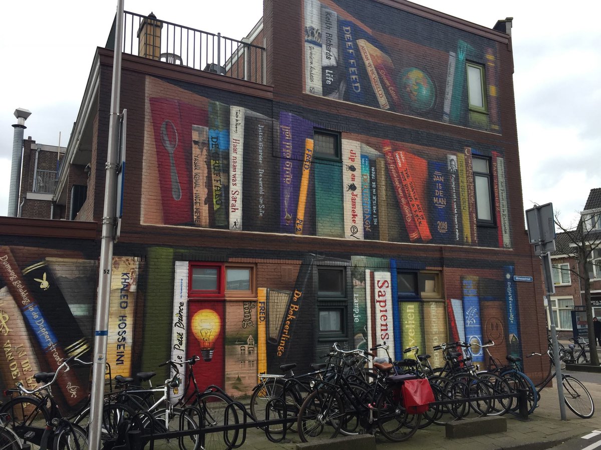 iPoetryinfo's tweet photo. A new mural in Utrecht, Netherlands by #JanIsDeMan (front) & #DeefFeed. The artists asked residents for their favorite books and then included those into the mural. https://t.co/p4IfM8iDhX