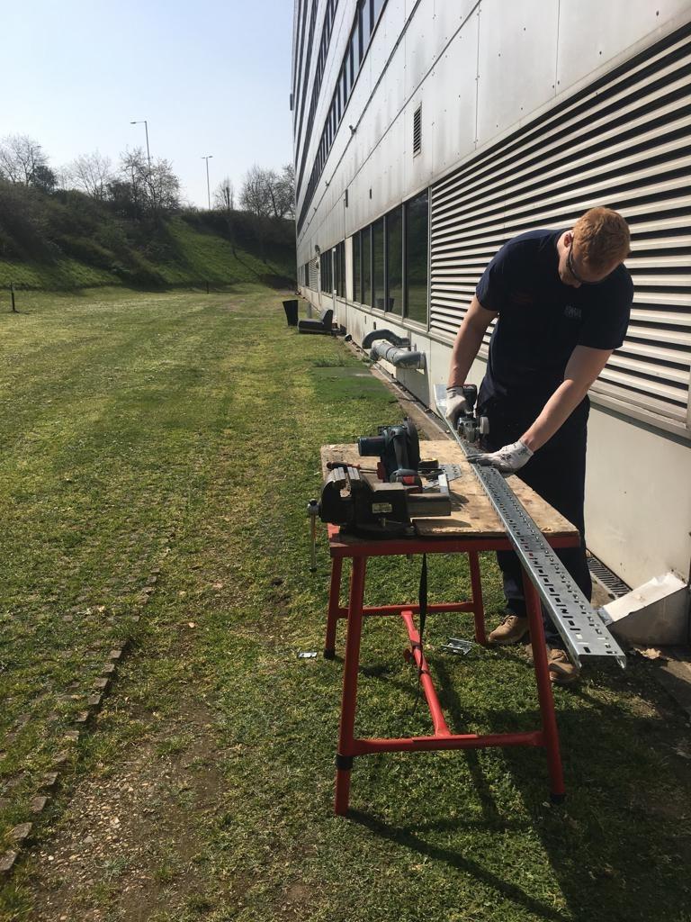 Happy Friday! Check out our #HELEngineer crafting out some 75mm cable tray. What a day to be working outside! What is everyone else up to? #FridayFeeling #Friyay #ElectricalWorks #Sparks #ElectricalEngineering