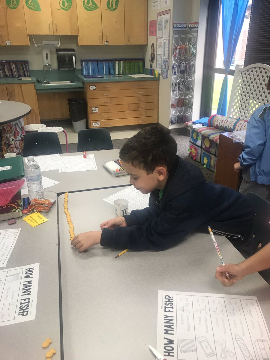 ElementaryNerd's tweet photo. Measuring with non-standard units is fun when those units are goldfish! I’m loving the natural conversations I’m hearing with words like “length”, “width”, and “estimate”. Such big terms for such little workers! #beverlylearns @StrongBobcats https://t.co/cQRyRZkPad