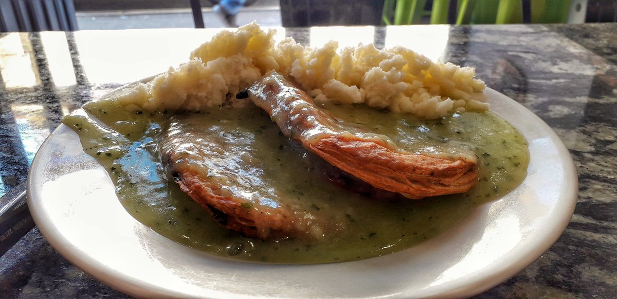 Pre turned South London #pieandmash with spoon and fork ( outside shot ). Soon to be drowned in chilli vinegar. Home comforts before another journey beyond the curry corridor 

<a href="/HarringtonsPie/">Harringtons Pie Mash</a> @TootingPRSS