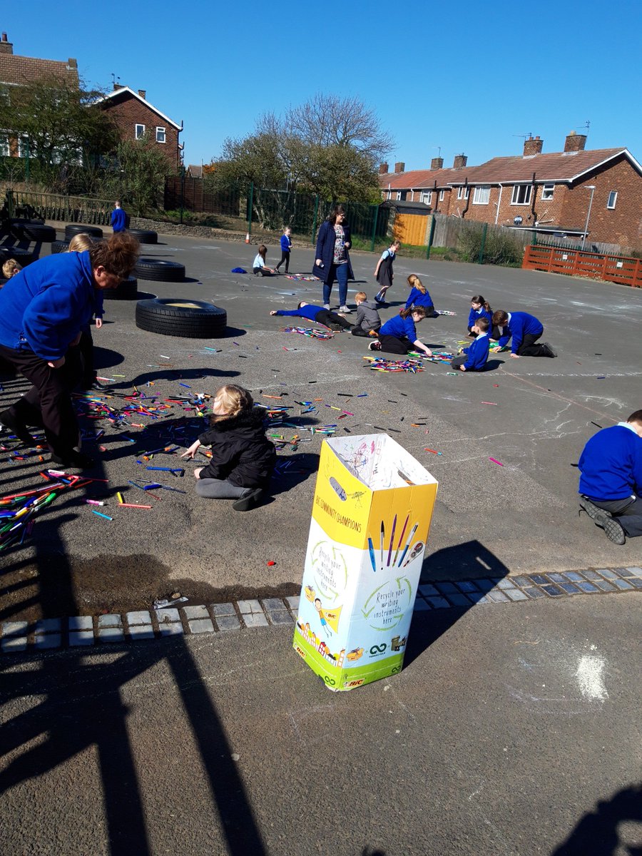 Family Group Time: Team Foster using recycled pens to make their point!