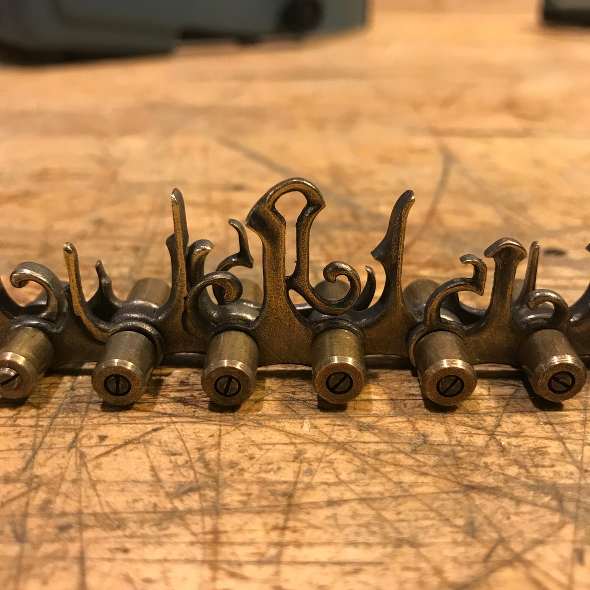 EricFreitas12's tweet photo. My latest commission will feature a nine-foot handmade chain. Here are a few closeup shots of the more detailed segments. Three feet finished, six to go. https://t.co/we7xry16EV