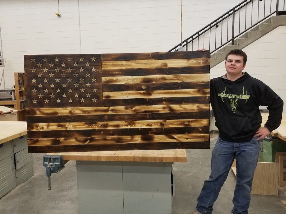 Junior Blaine Dorn in Advanced Woods finished 3' x 6' American flag today made out of 1x4's and 1x6's. He made it for Imperial Auction Market. #chasecopride <a href="/ccs_longhorns/">Chase County Schools</a>