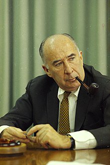 Picture of John Mitchell with a pipe.