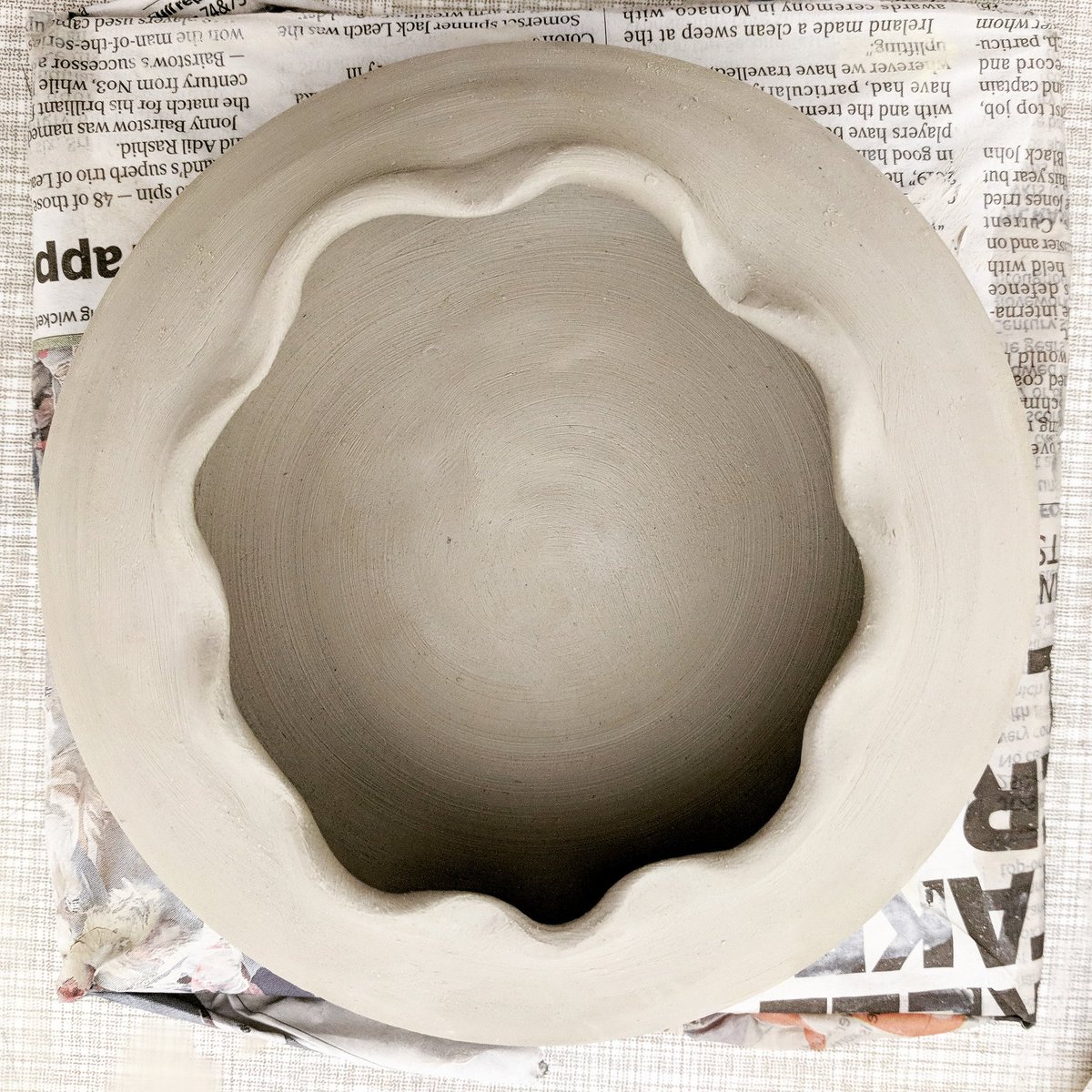 A subtly manipulated form thrown on the wheel with a curved bottom. #ceramics #pottery #handmade #thrownforms #sculpturalforms #studiopractice #studiowork #patterns @edoyledesigns