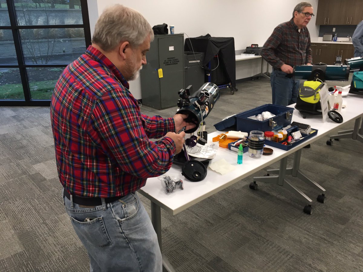 SLASLibrary's tweet photo. Volunteers at @stlastro performing maintenance of #librarytelescope at @SLCL.  Rainy outside and a good day to be inside at the Oak Bend Branch. https://t.co/U4cxR74jZH