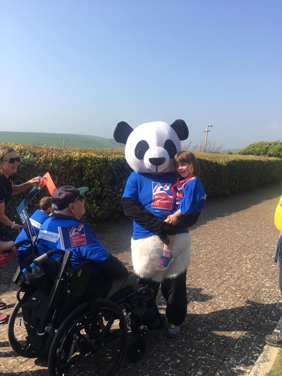 BlindVeterans's tweet photo. She did it! Jane and her 92 year old uncle Reg, who’s a blind veteran, took part in the #MarchForVeterans walk in Brighton today - and Jane did the entire 10 miles in a panda suit! 🐼👏 https://t.co/L7UMjbU3zl https://t.co/Tc0qpLbwpN