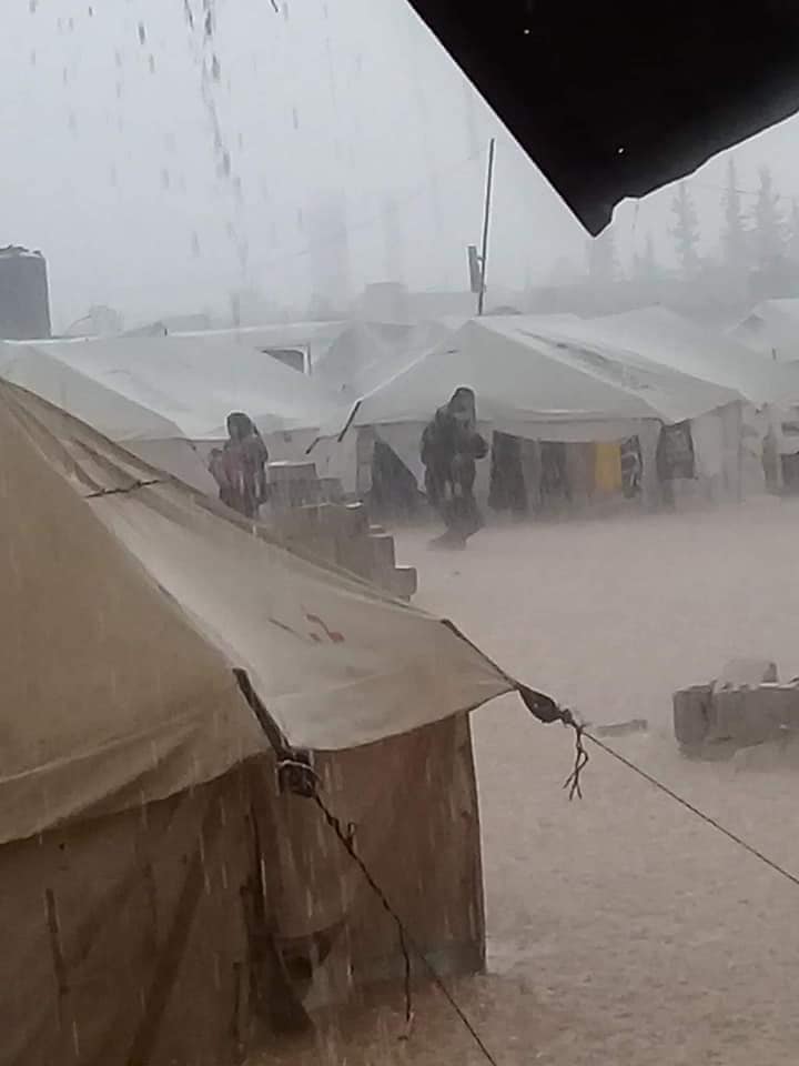 SyriaCivilDef's tweet photo. The already bleak living conditions of several camps in northern #Syria have come under heavy and damaging rains. #WhiteHelmets are on site providing as much aid and assistance as possible in the affected camps as the flooding continues. https://t.co/raI4aAn0xV