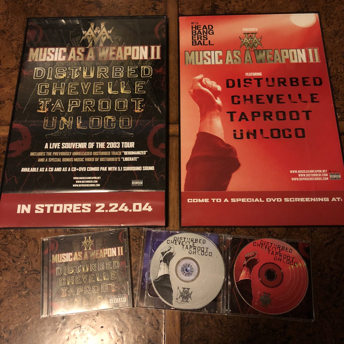 DisturbedFP's tweet photo. Just framed these two promo posters for @Disturbed’s  #MusicAsAWeapon album. This album features live performances from the 2003 @MAAW_Tour.
This was released as a CD and a CD/DVD combo pack. How many of you #Disturbed Ones have this CD or the CD/DVD? https://t.co/MPl1NdJblr