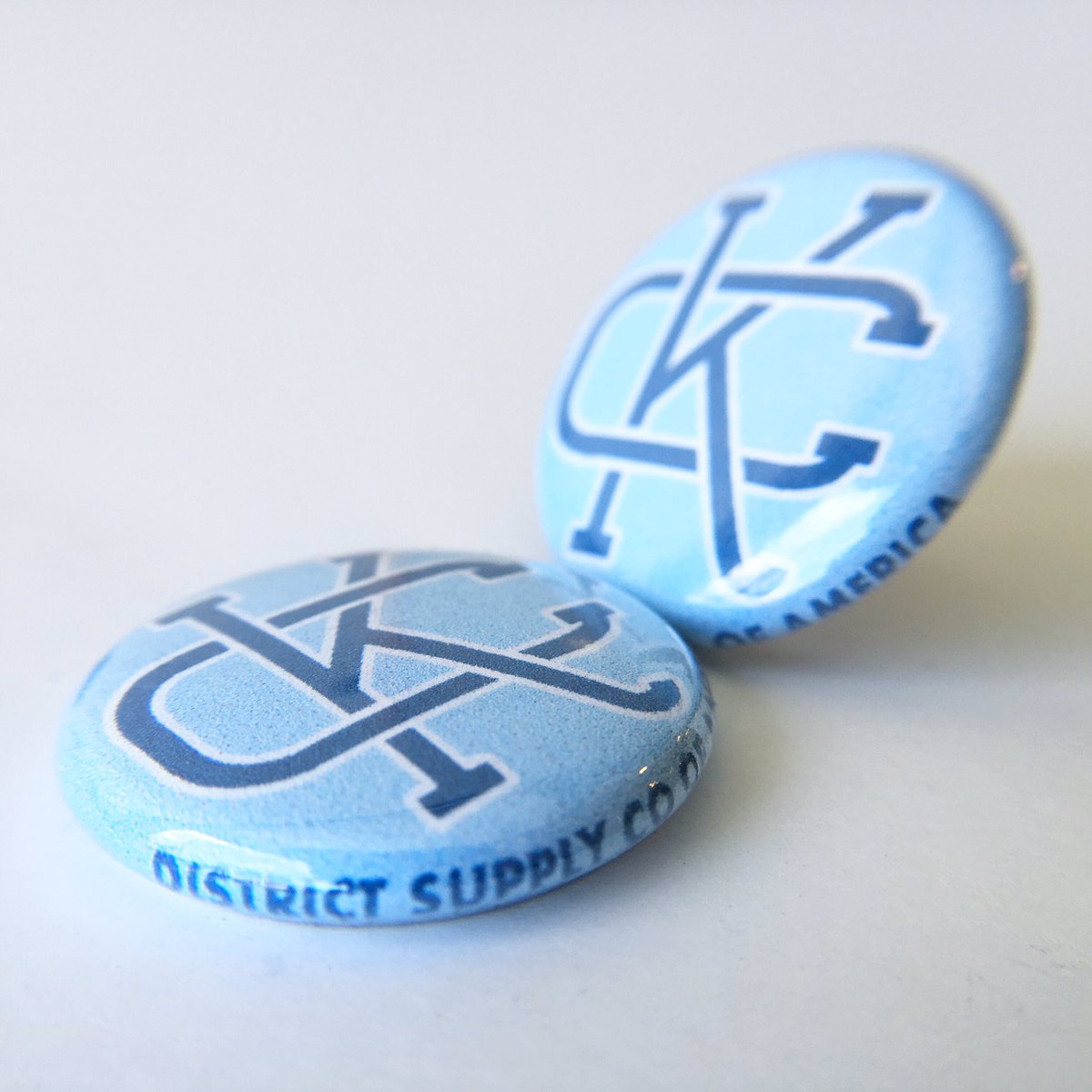 All of our local apparel comes with a free button! Buy a shirt, get a button. Buy TWO shirts, get TWO buttons. Buy THREE shirts, get... you get the idea. Come get free buttons!