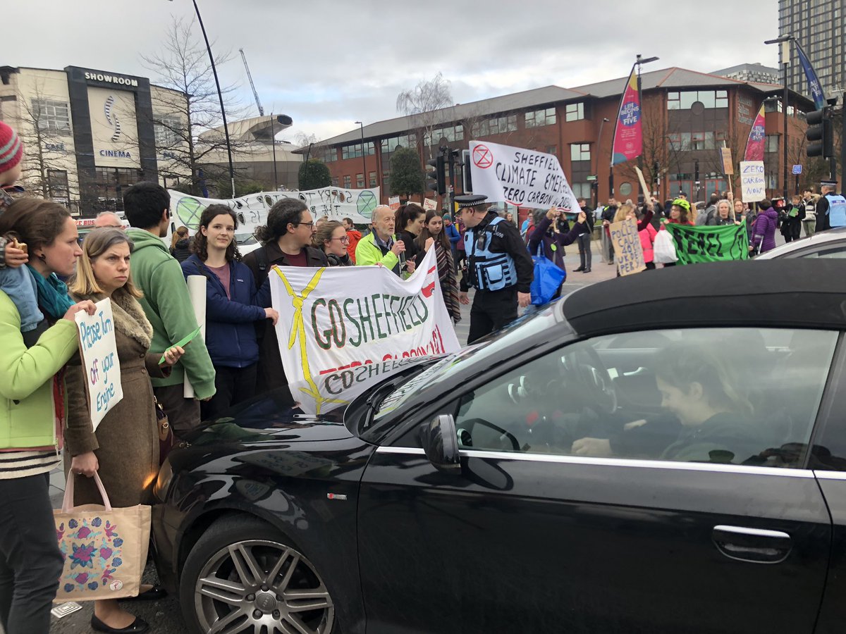 HitsSYorksNewsX's tweet photo. There’s absolute traffic chaos here on Sheaf Street I’m #Sheffield city centre as climate change protesters carry out road blocks to raise awareness of high pollution levels. https://t.co/Uhu165h5XZ