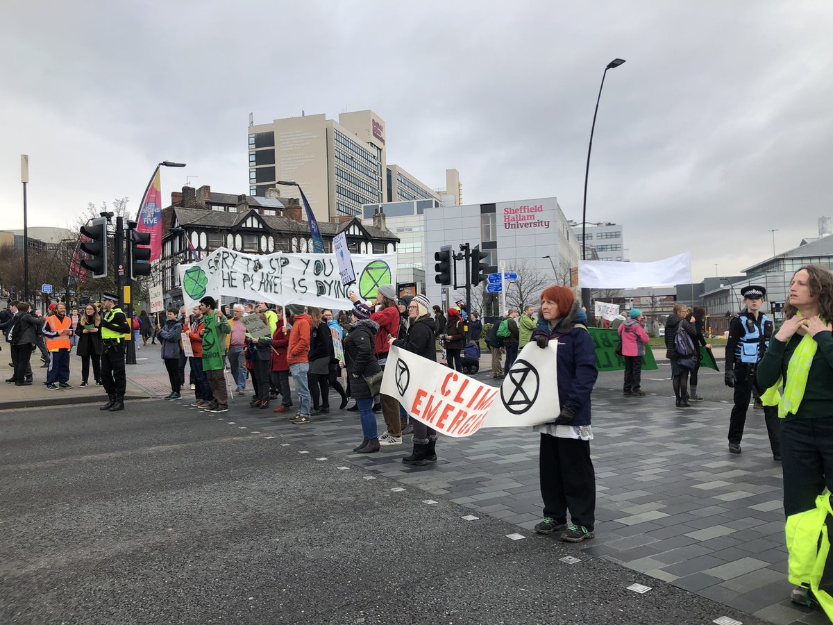HitsSYorksNewsX's tweet photo. There’s absolute traffic chaos here on Sheaf Street I’m #Sheffield city centre as climate change protesters carry out road blocks to raise awareness of high pollution levels. https://t.co/Uhu165h5XZ