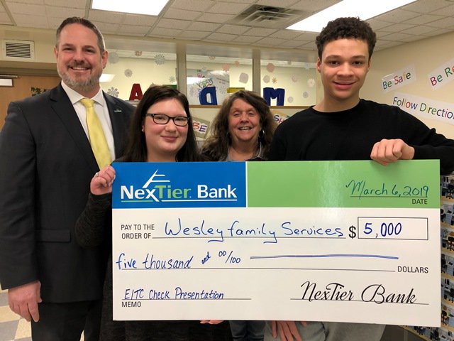 NexTier's tweet photo. The #travelingcheck took us to Wesley High School for technology.  We had a wonderful time visiting with the students and staff, and look forward to seeing what the future holds. The two students were Paige Matus and Simon Morris, Nita Menendez – Asst. Director Wesley High Sch. https://t.co/n52DpsTrjc