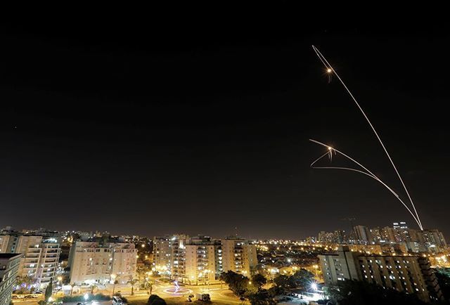 The shape of the interceptor's trajectory is generated by the weapon system, to ensure the interceptor is given optimal conditions for the intercept.A good example can be seen in this picture of an Iron Dome intercept. The interceptor does not fly a straight line to the kill.