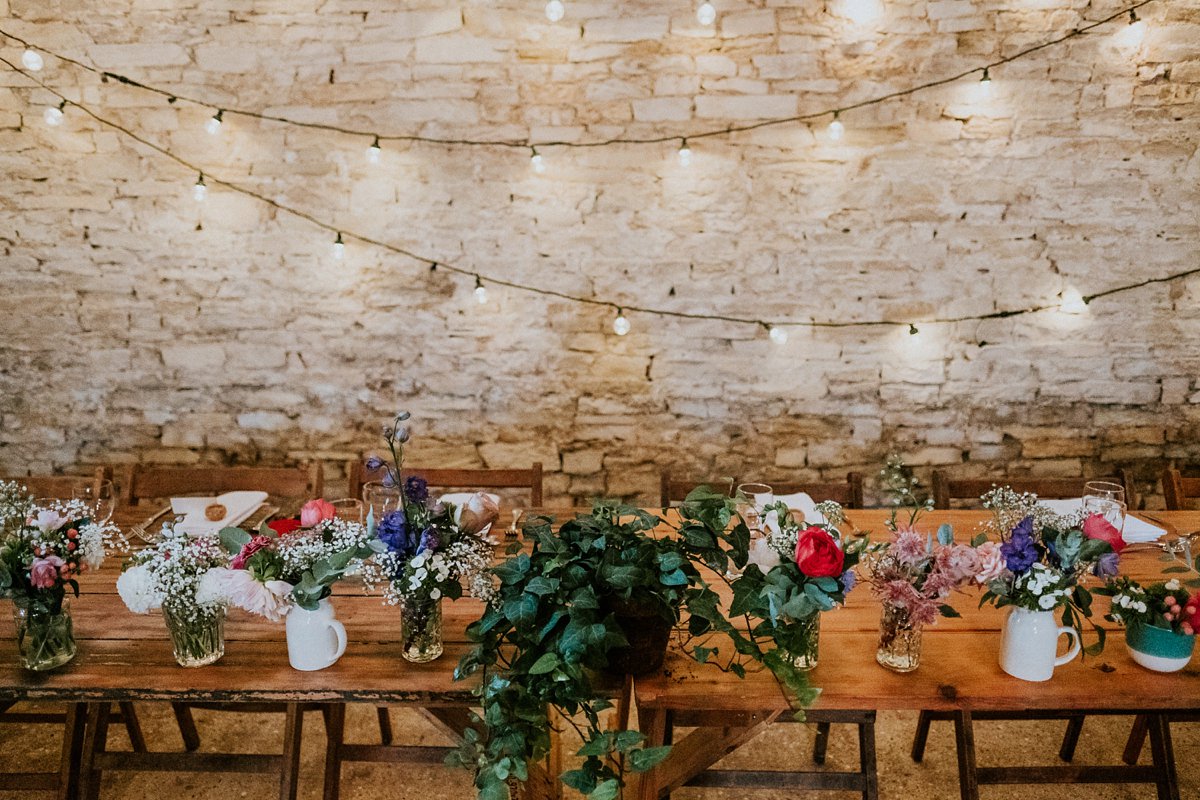 Fairy lights and 'just picked' flowers add rustic charm to a country barn wedding>bit.ly/2UKfRUq