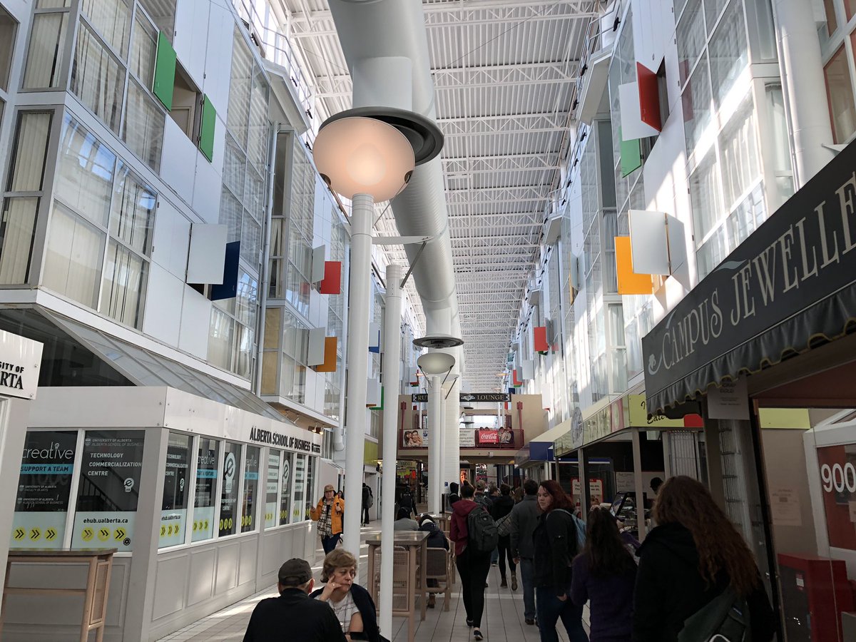 Mall with college apartments above. On U of A campus.