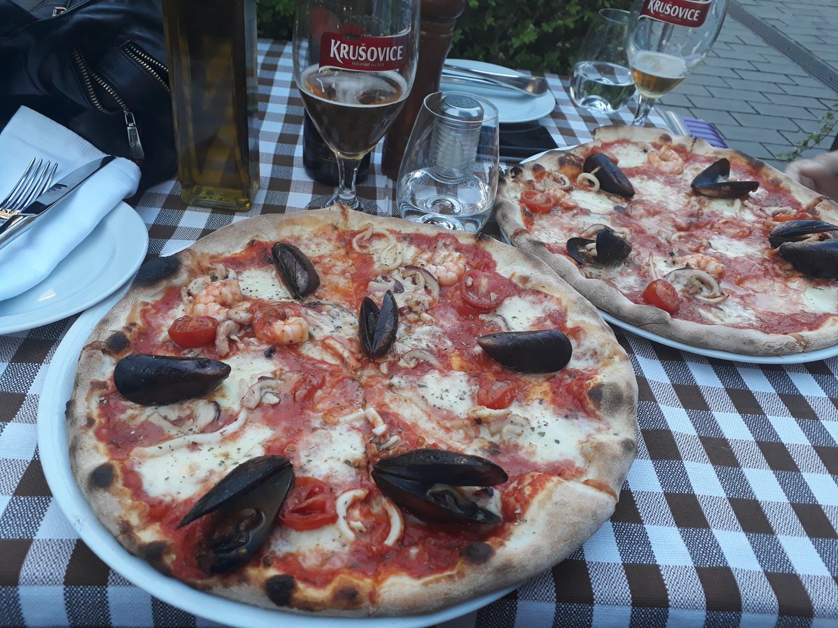 eesabroad's tweet photo. Seafood Pizza with the famous Krusovice beer in Prague. Prague is well-known for its beautiful architecture and beer, but there is so much more to this well-loved city.  Try the #Czech food when visiting Prague with EESA either on the Summer Europe - East to West program more! https://t.co/DR7ewUhMKm