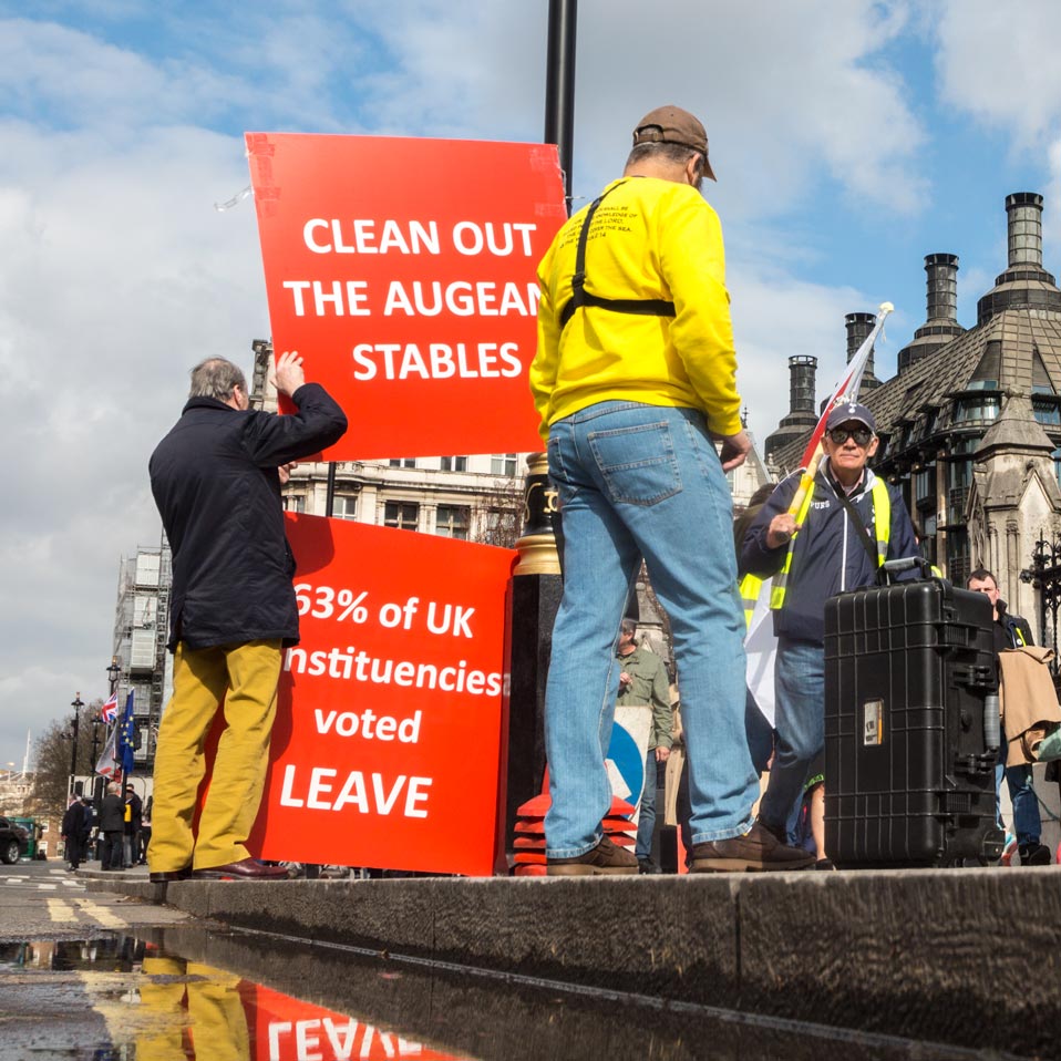 NicholasCobb11's tweet photo. The #voteleave chap in the dark hat asked the #preacher [in yellow] what he was going on about. He pointed at the statue of #olivercromwell and said "Him". #brexitsbarmy #MakeItStop The preacher fell silent as the Yellow Vests walked by... https://t.co/emjeovxECx