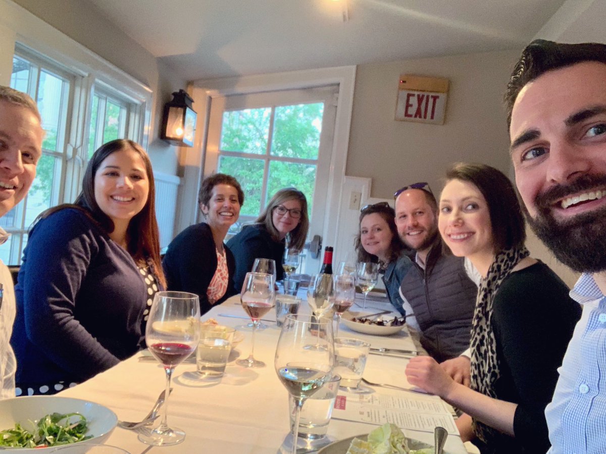 Group of people tagged at dinner table smiling