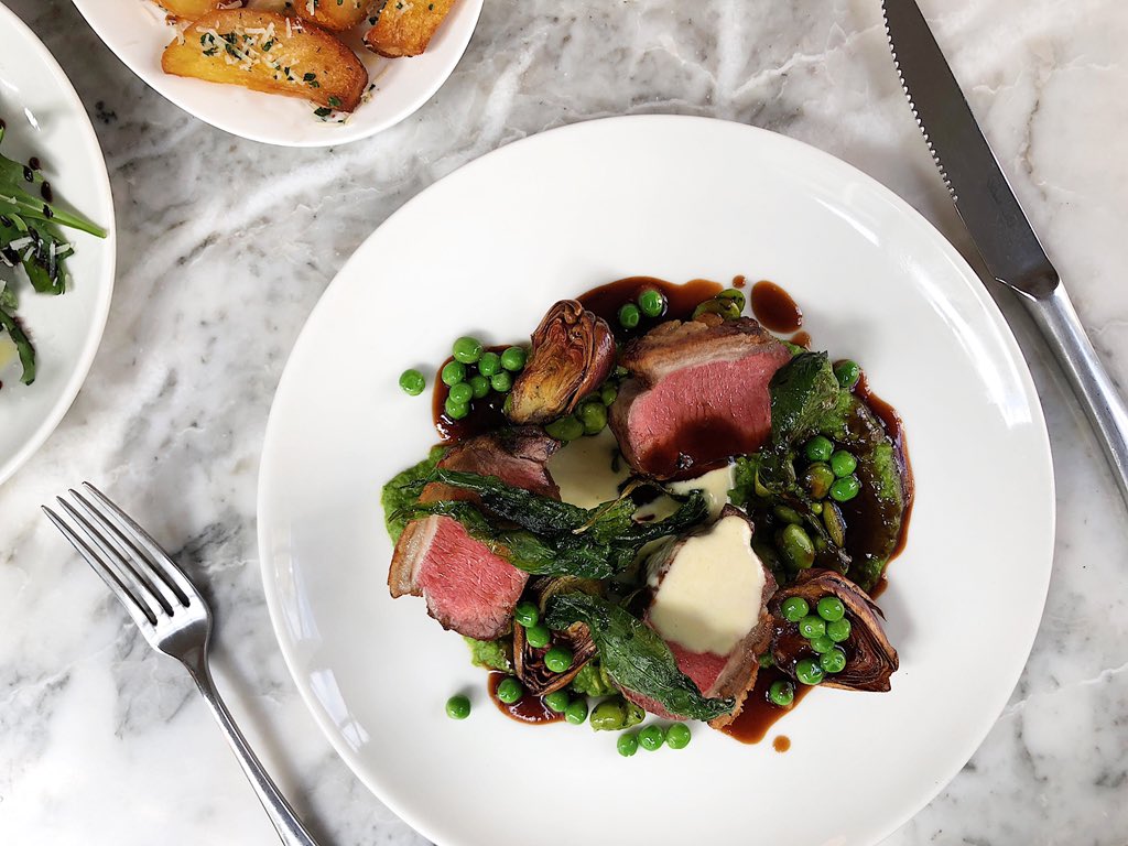 Roasted lamb loin with bagna cauda, baby artichoke, wild garlic, broad beans &amp; new peas.