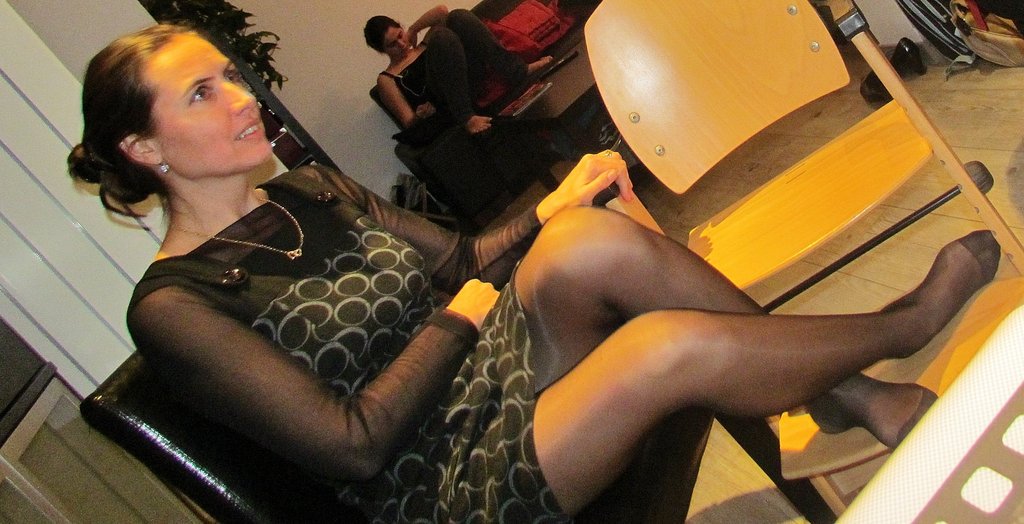 Bending woman club pantyhose