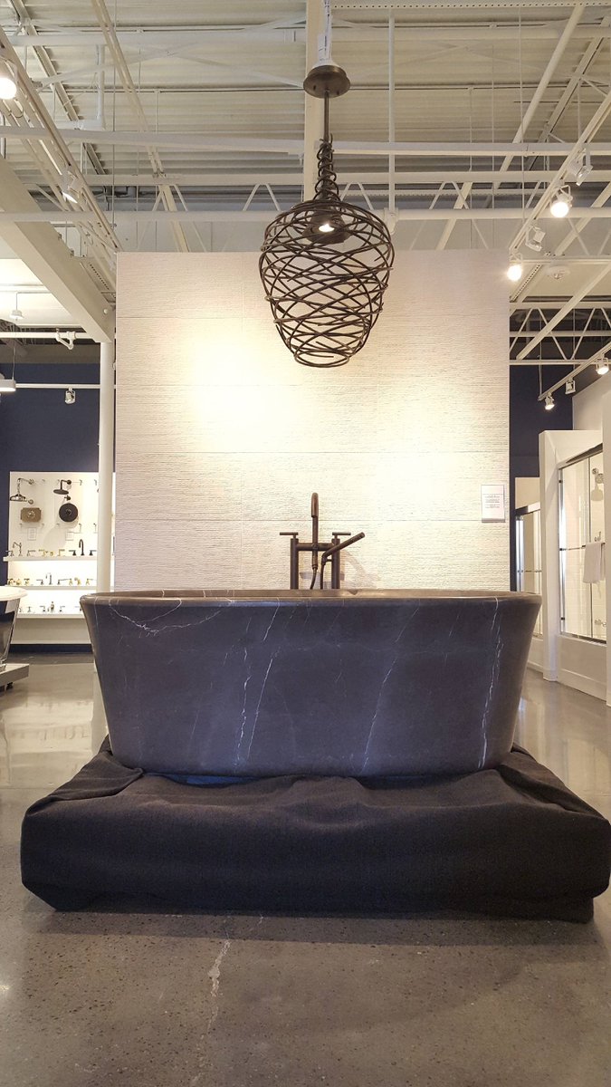 DesignerBath's tweet image. Because your bathtub should always be the biggest scene-stealer, statement-maker and conversation-starter in the room. This one-of-a-kind @StoneForestNM stunner (hand-crafted from marquina taupe marble) has found a home on display at our #Watertown showroom.