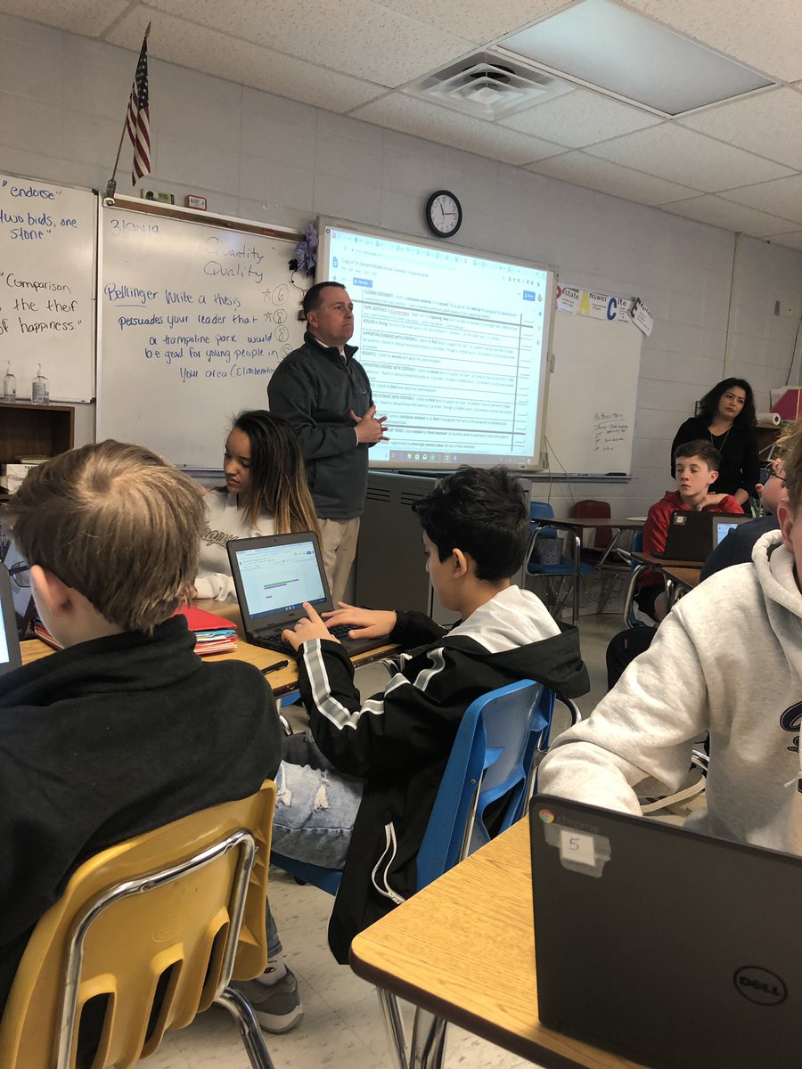 BluegrassDawgs's tweet photo. HCS Chief Academic Officer, Greg Sutton is back in English classes! Today, he’s working with Mrs. Stewart’s 8th grade on writing! #HCSStrongerTogether #runforsuccess @stewart https://t.co/eBSmSx4Txi