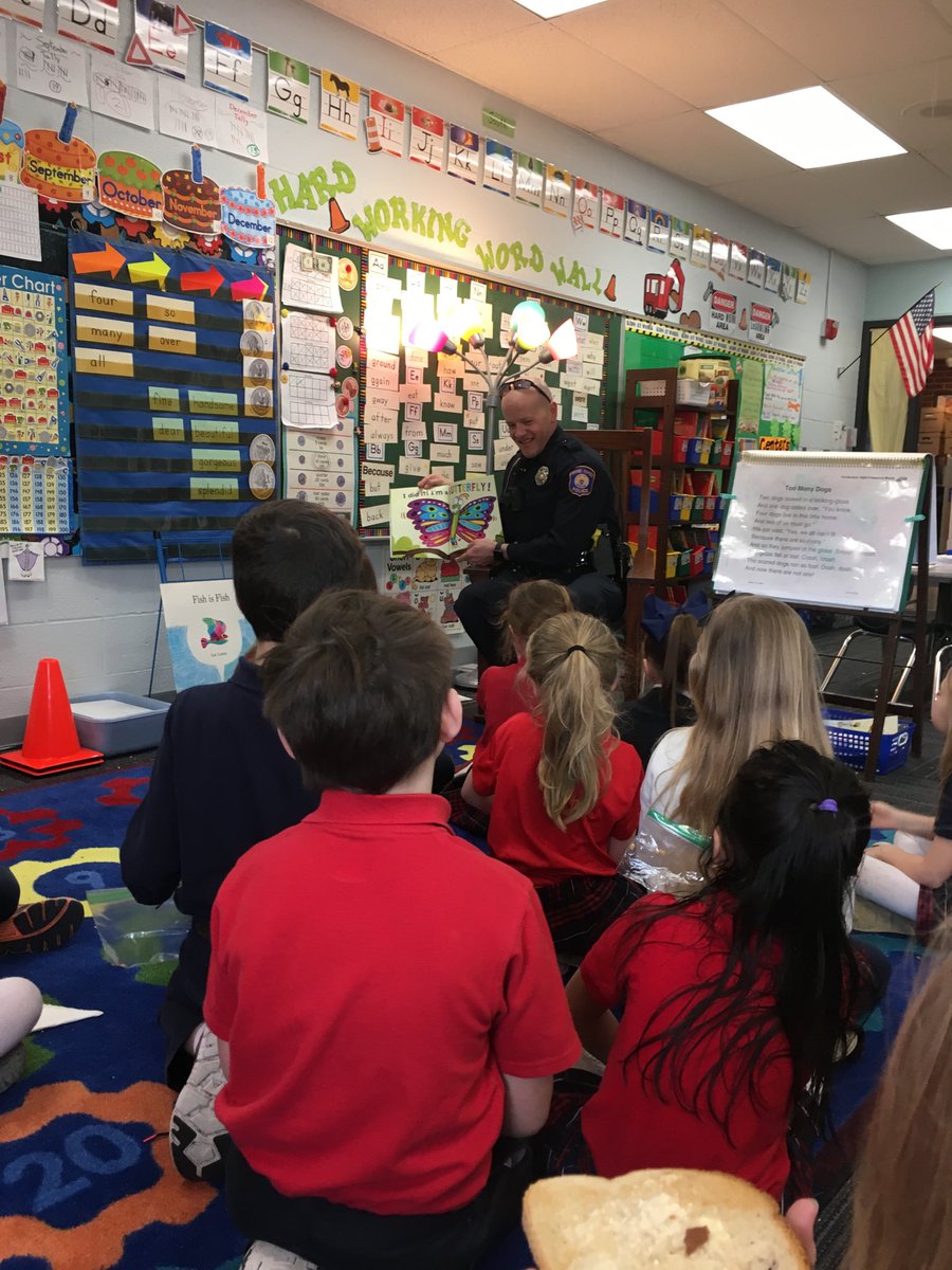 IHMGR's tweet photo. Thanks GRPD Officer Chad VanDam for visiting our classrooms as a guest reader. The students loved having our community police officer as a guest! https://t.co/laxLlbnJBC