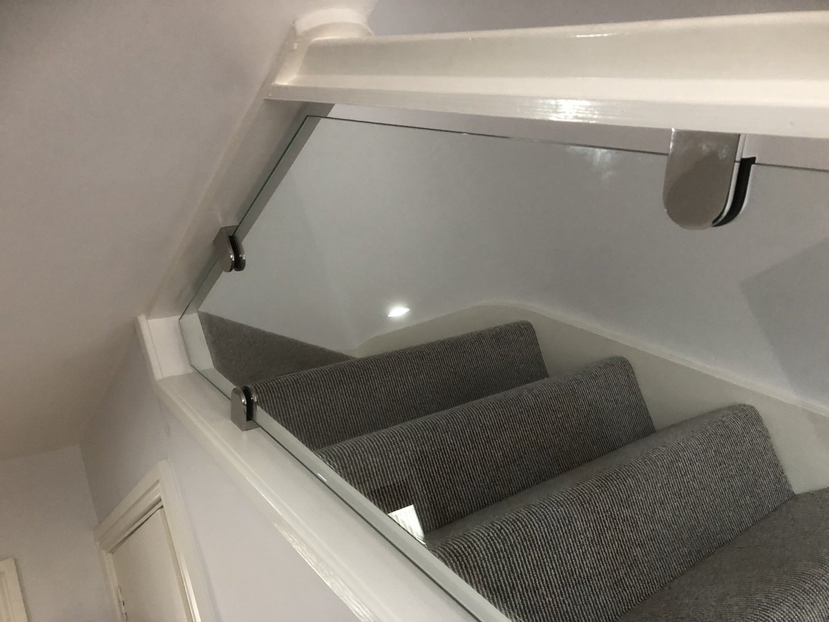 Templates made and 10mm toughened polished edge glass balustrade fitted on chrome clamps to staircase revamp #Glazier #Northumberland